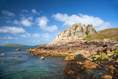 British Isles coastline and historic castle